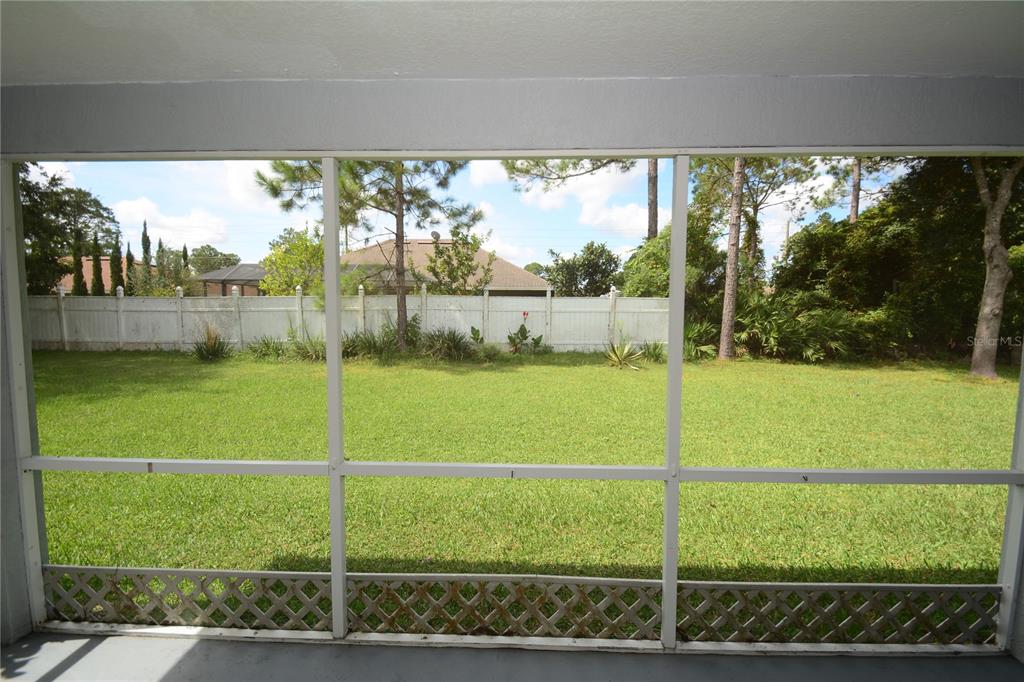 37 Eton Lane, Unit A Palm Coast, FL 32164 - Photo 30 of 34 a view of a garden from a window