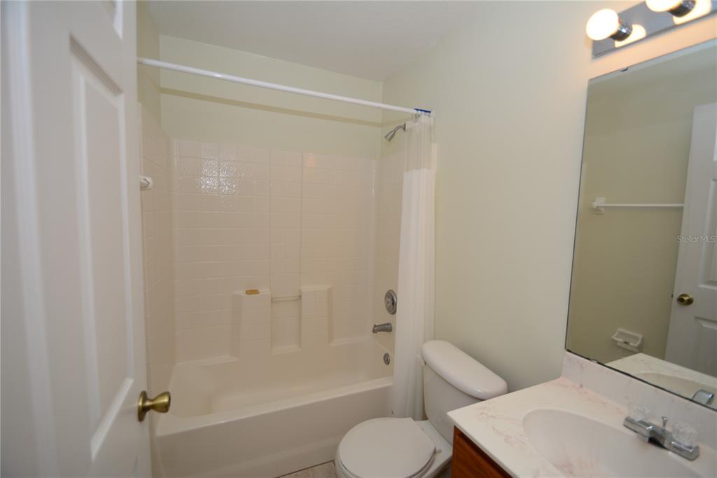 37 Eton Lane, Unit A Palm Coast, FL 32164 - Photo 34 of 34 a bathroom with a toilet and a bathtub