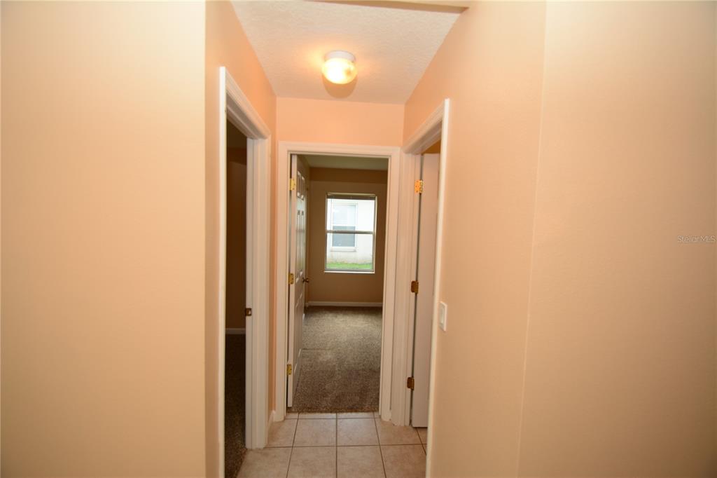 37 Eton Lane, Unit A Palm Coast, FL 32164 - Photo 6 of 34 a view of a bathroom from a hallway