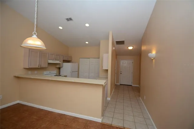 a view of a kitchen with a sink and a vanity
