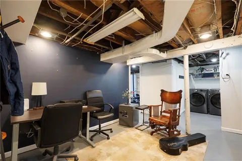 a view of a workspace with furniture