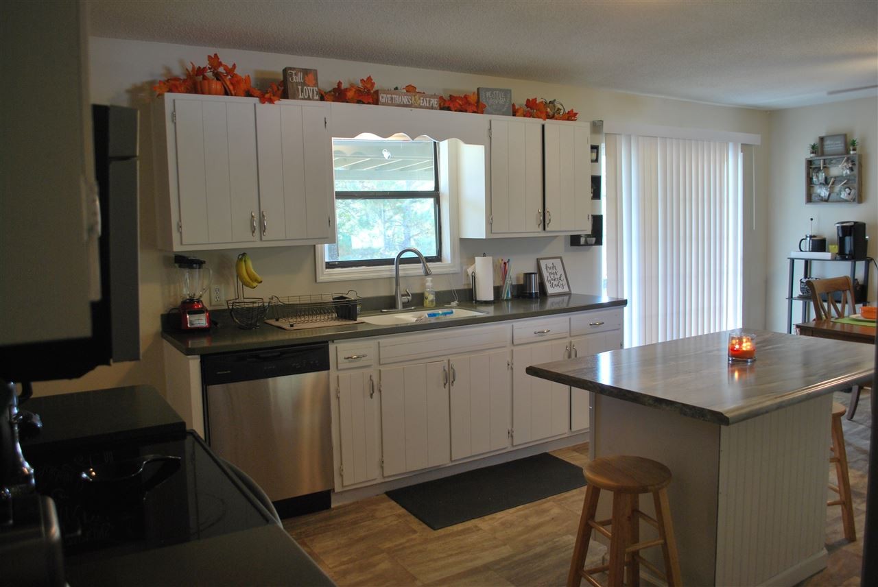 1239 Armstrong Road Southeast Cleveland, TN 37323 - Photo 6 of 33 a kitchen with a sink cabinets and window