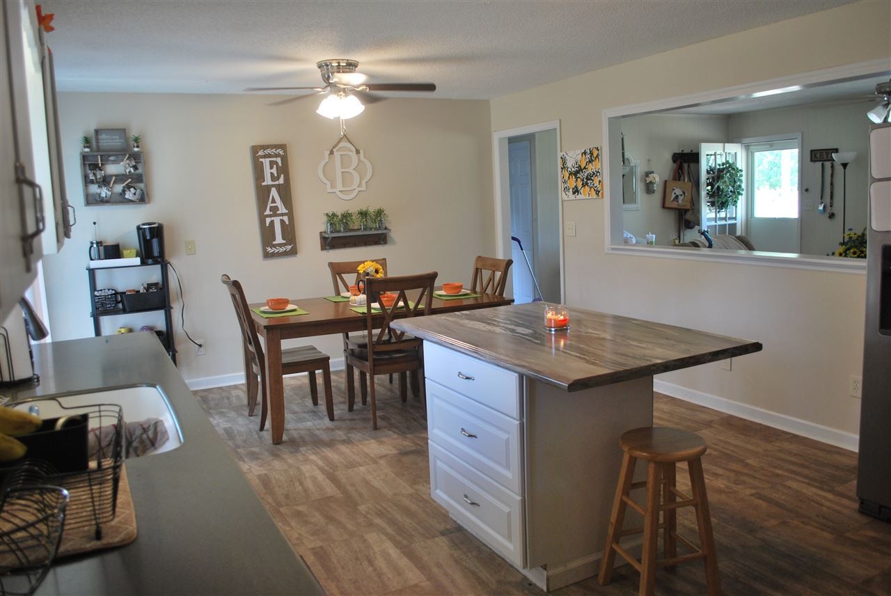 1239 Armstrong Road Southeast Cleveland, TN 37323 - Photo 9 of 33 a view of a dining room with furniture and wooden floor