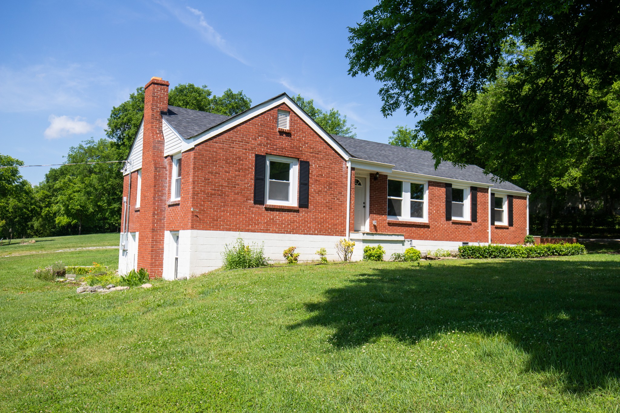 Undisclosed Address Madison, TN 37115 - Photo 12 of 17 a front view of a house with a yard
