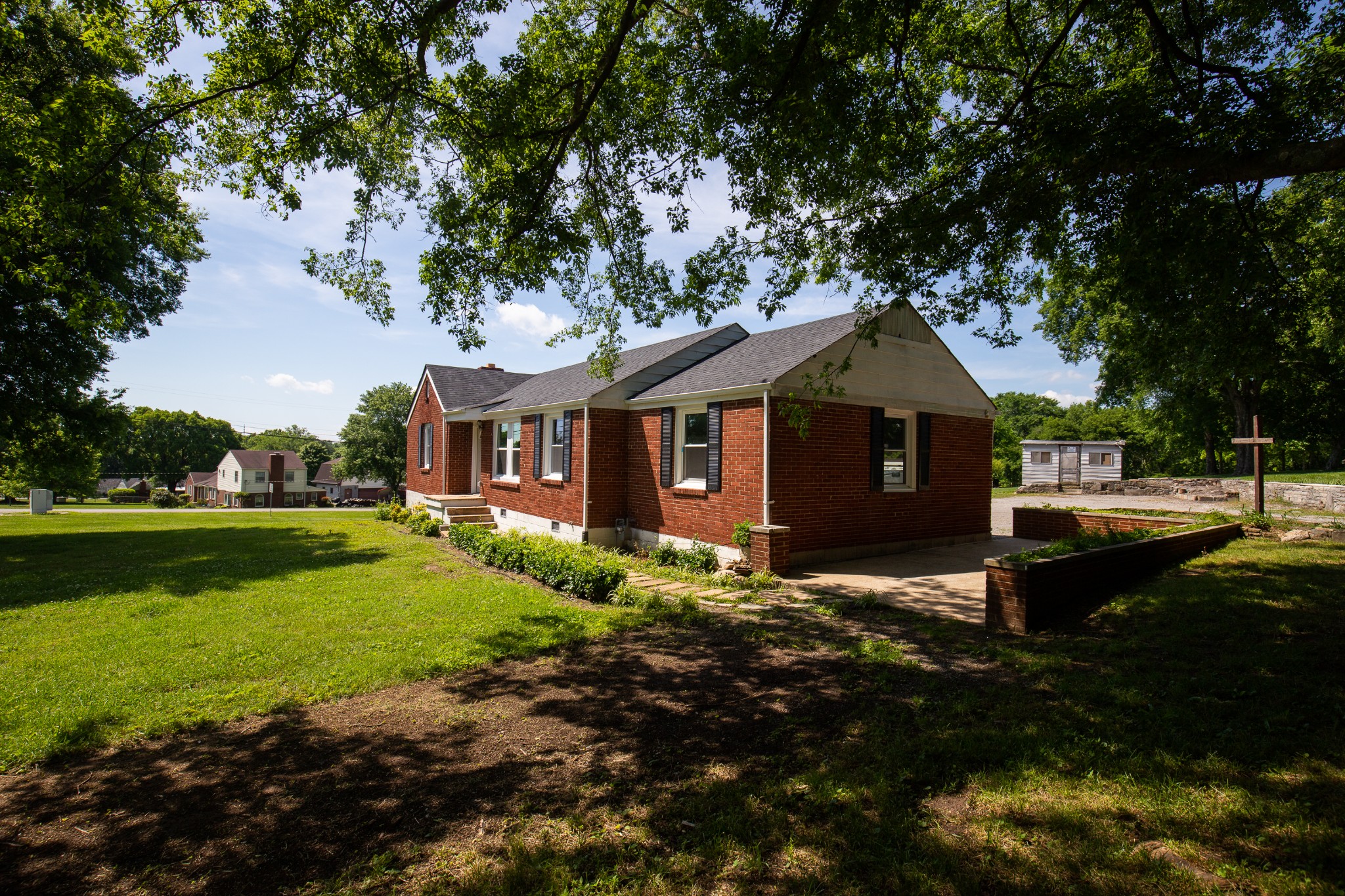 Undisclosed Address Madison, TN 37115 - Photo 15 of 17 a front view of a house with garden