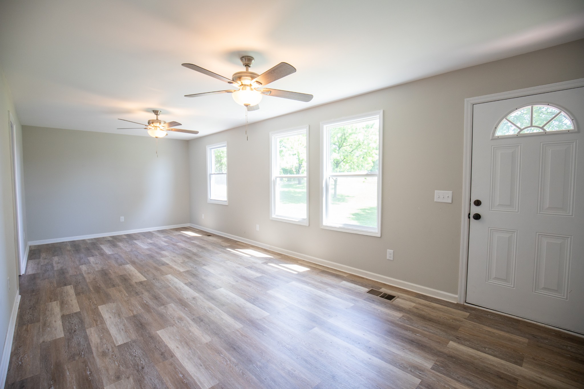 Undisclosed Address Madison, TN 37115 - Photo 5 of 17 wooden floor in an empty room with a window