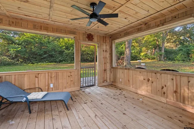a view of a deck with wooden floor and outdoor space
