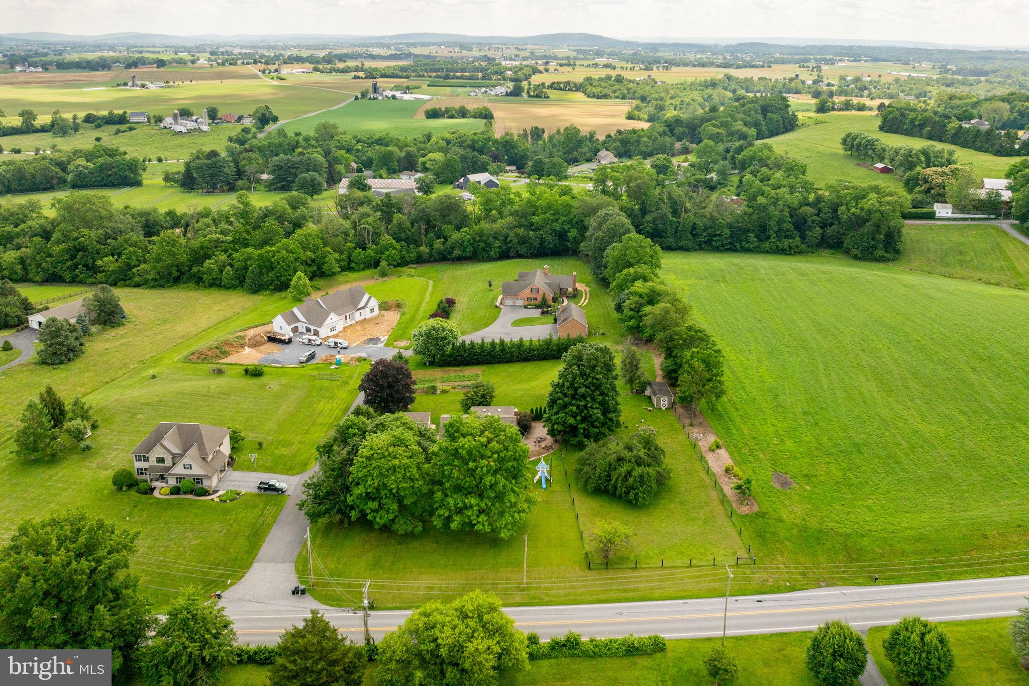1504 Brunnerville Road Lititz, PA 17543 - Photo 3 of 55 an aerial view of a houses with a yard and lake view