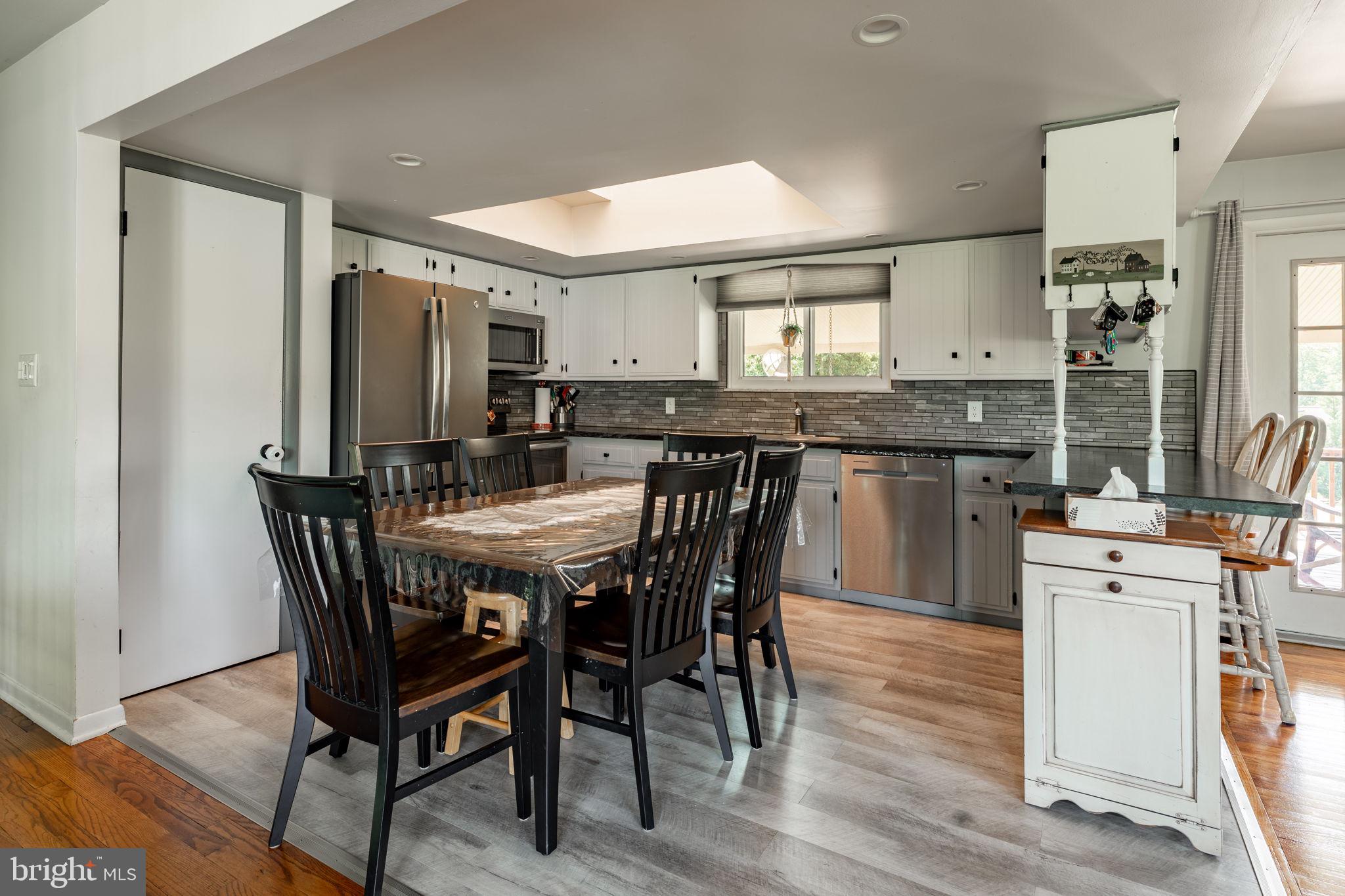1504 Brunnerville Road Lititz, PA 17543 - Photo 35 of 55 a view of a dining room with furniture and wooden floor
