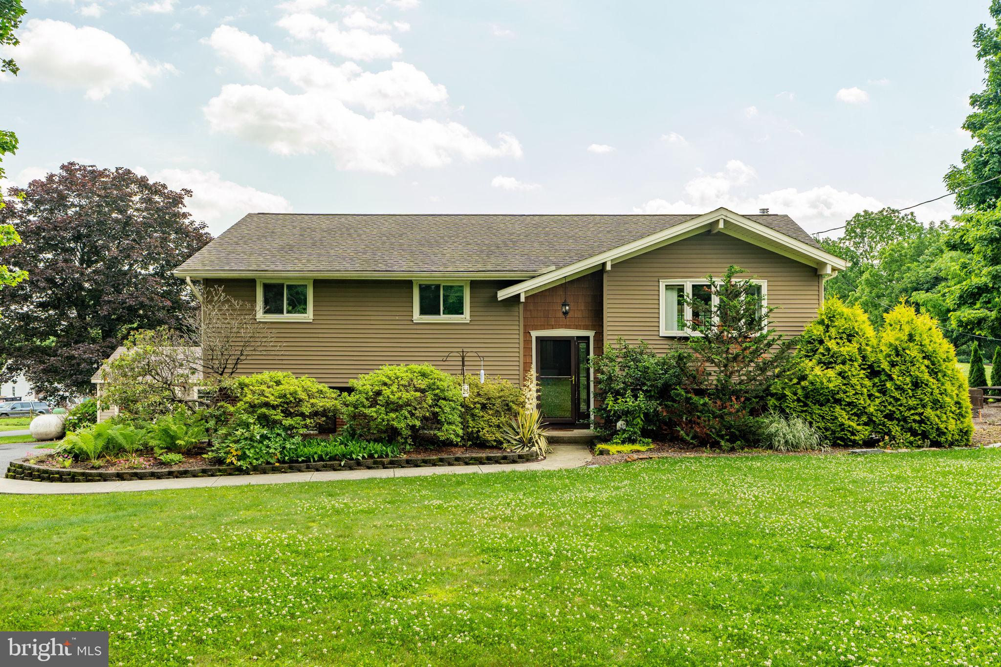 1504 Brunnerville Road Lititz, PA 17543 - Photo 8 of 55 a front view of house with yard and green space