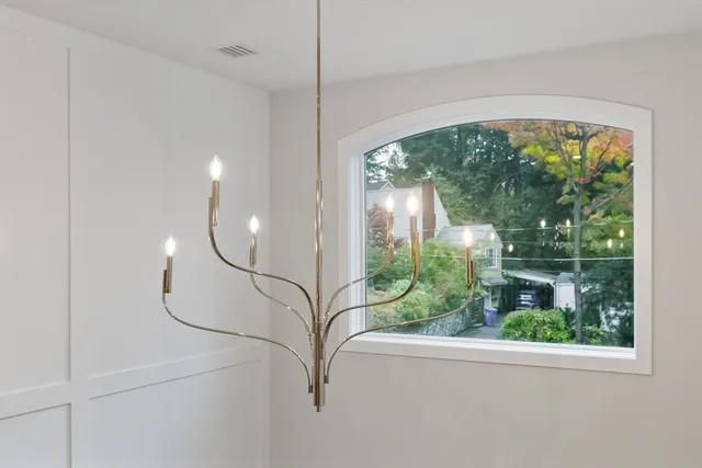 a view of a work space with furniture and window