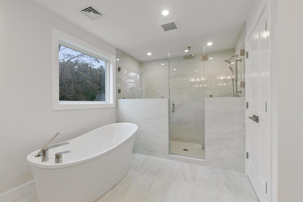 4 Adams Street Wakefield, MA 01880 - Photo 14 of 41 a bathroom with a bathtub and shower
