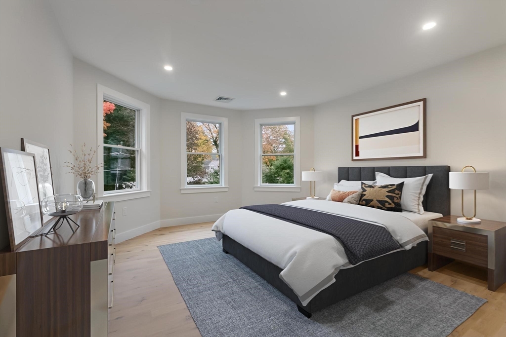 4 Adams Street Wakefield, MA 01880 - Photo 19 of 41 a spacious bedroom with a large bed and a window