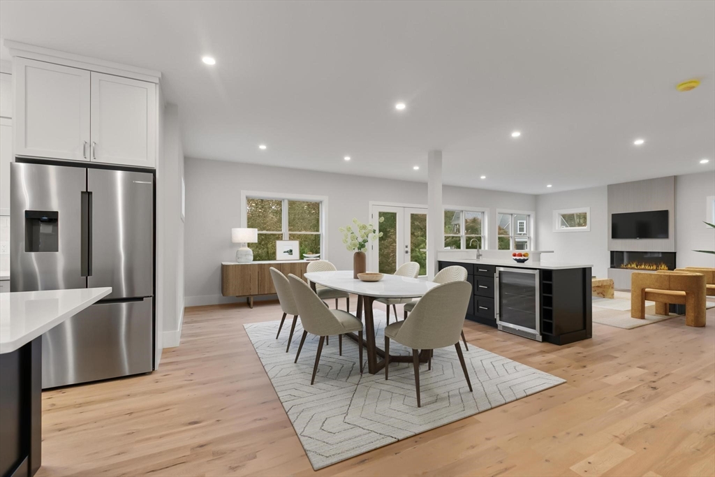 4 Adams Street Wakefield, MA 01880 - Photo 2 of 41 a view of a dining room with furniture a rug and wooden floor