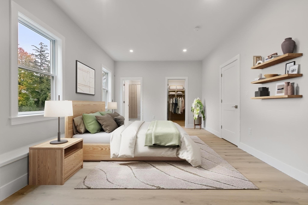 4 Adams Street Wakefield, MA 01880 - Photo 22 of 41 a bedroom with a large bed and a window