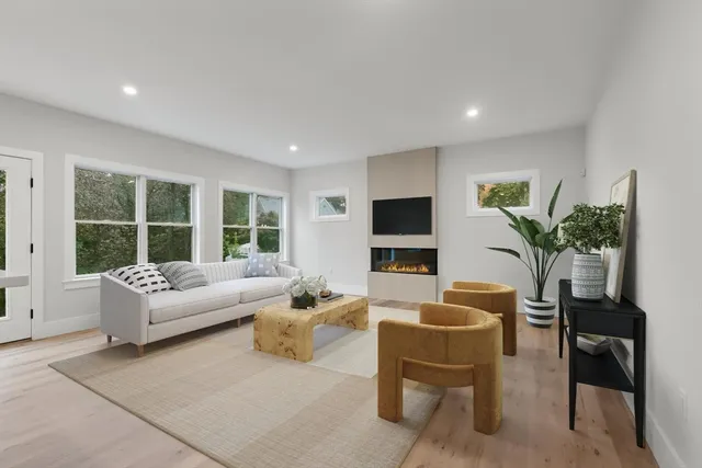 a view of staircase with wooden floor and white walls