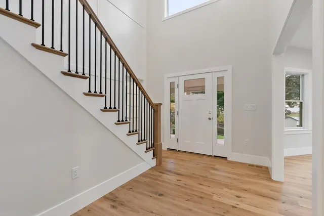 a bathroom with a sink mirror and a shower