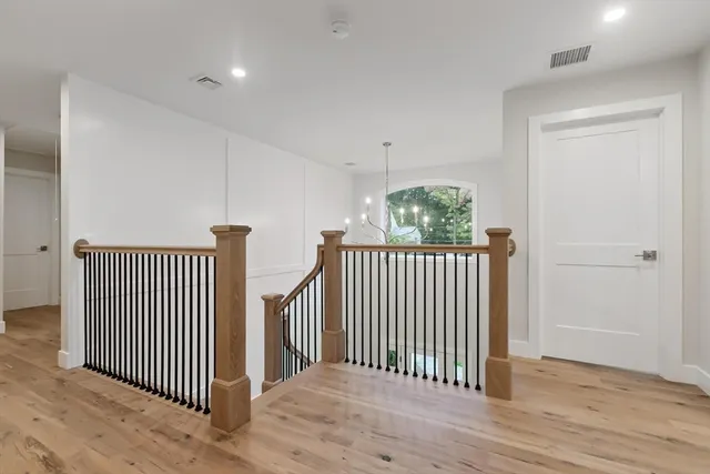 a spacious bedroom with a large bed and a window