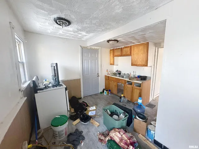 a dining room with furniture and a window