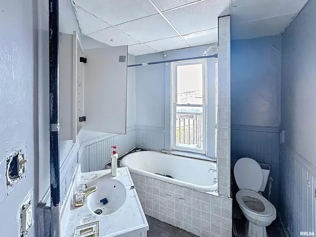 a kitchen with a sink stove and refrigerator