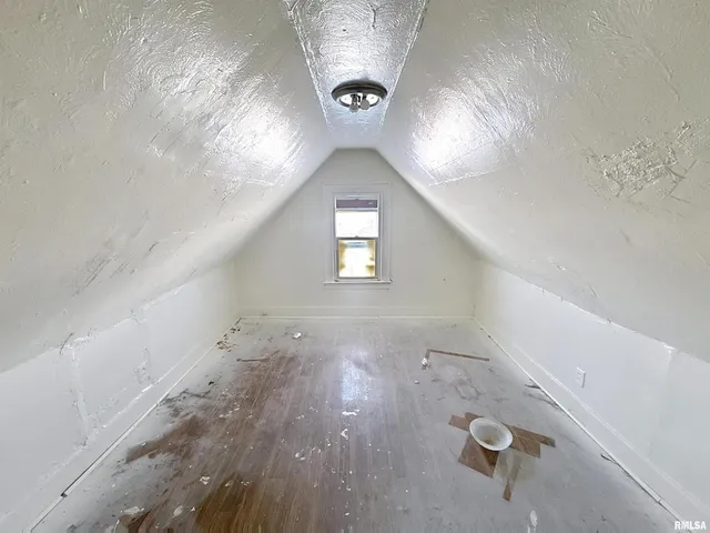 a view of roof deck with table and chairs