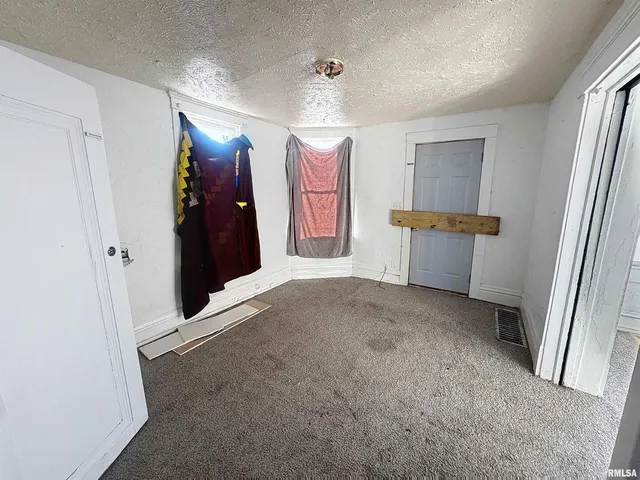a view of a room with window and closet