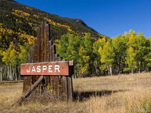 a view of a street with a building in the background