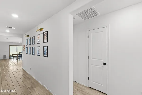 a view of an entryway with wooden floor