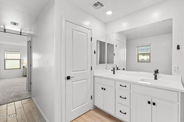 a bathroom with a granite countertop sink mirror and double
