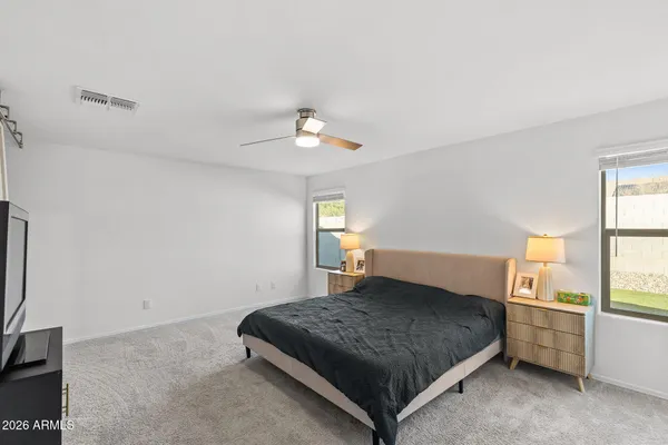 a bedroom with a bed and window