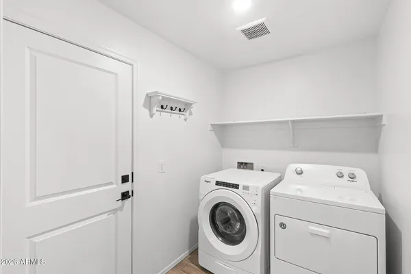 a utility room with dryer and washer