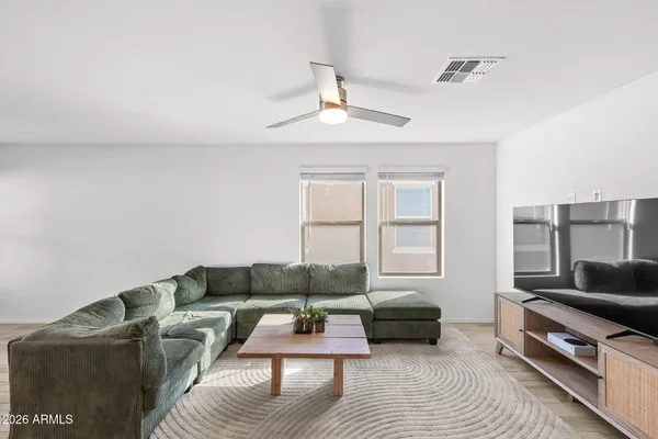 a living room with furniture and a window