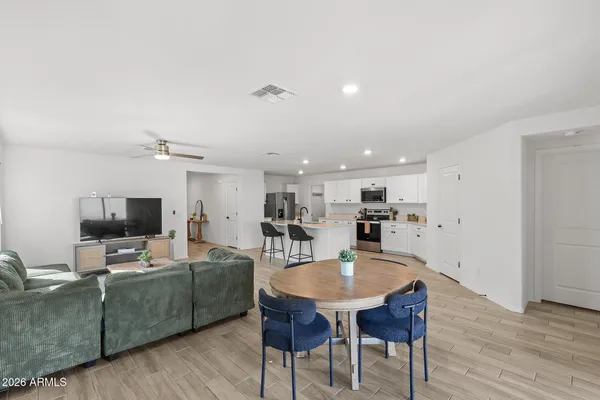 a view of a dining room with furniture and wooden floor