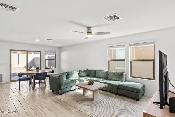a living room with furniture and a large window