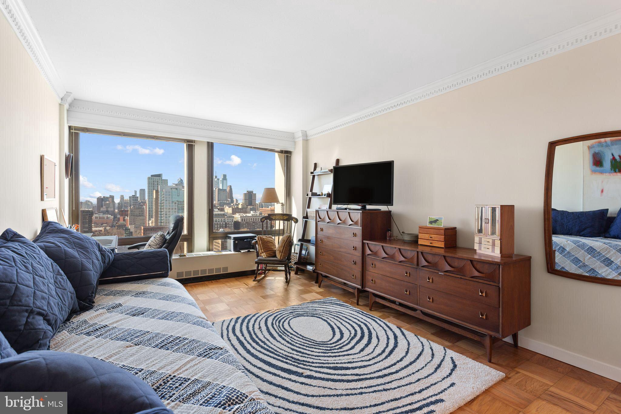 200 Locust Street, Unit 29AN Philadelphia, PA 19106 - Photo 22 of 58 a living room with furniture and a flat screen tv