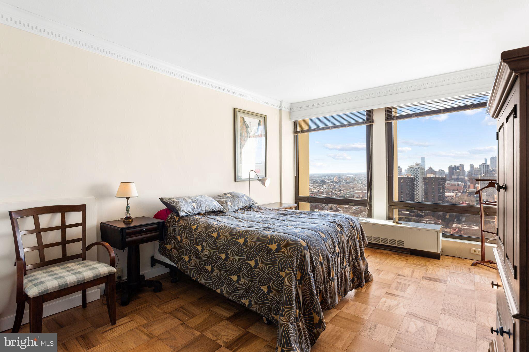 200 Locust Street, Unit 29AN Philadelphia, PA 19106 - Photo 25 of 58 a bedroom with a bed and a large window
