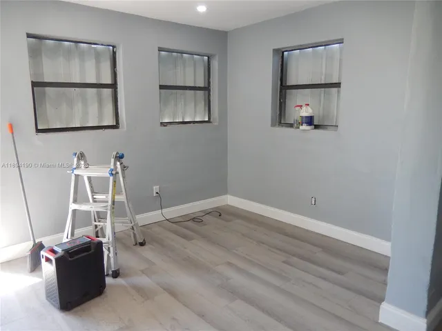 a kitchen with a sink cabinets and appliances