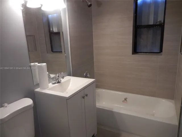 a bathroom with a sink toilet and bathtub