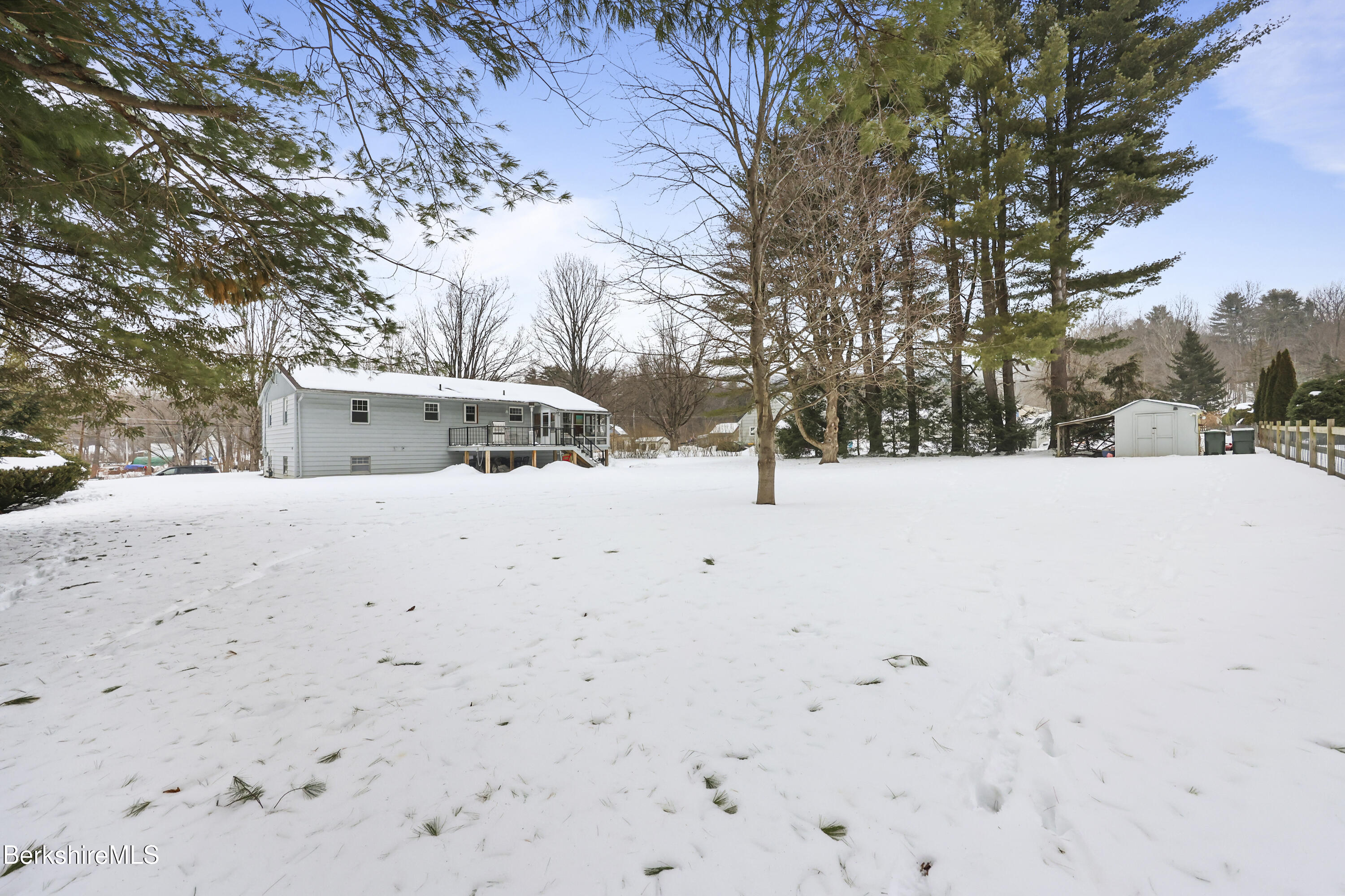 184 Washington Mountain Road Lee, MA 01238 - Photo 40 of 42 a view of white house with a snow covered with snow