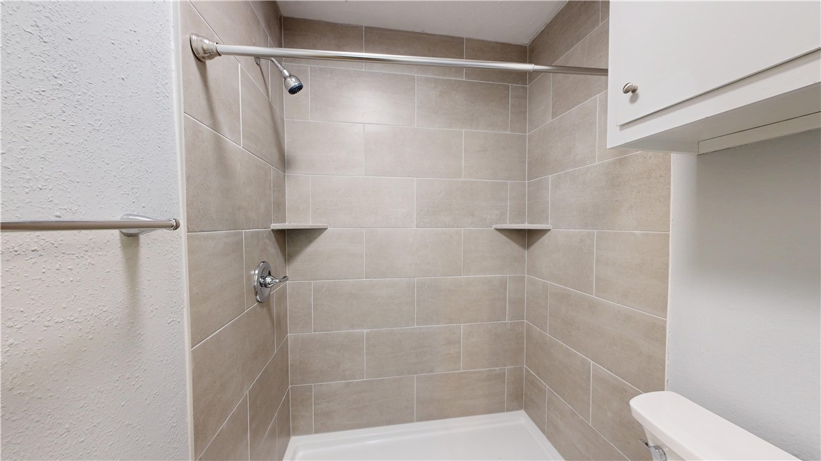 1325 Airline Drive College Station, TX 77845 - Photo 11 of 26 a bathroom with a shower and a toilet