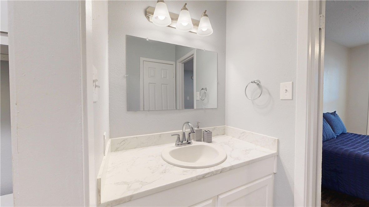 1325 Airline Drive College Station, TX 77845 - Photo 12 of 26 a bathroom with a sink and a mirror
