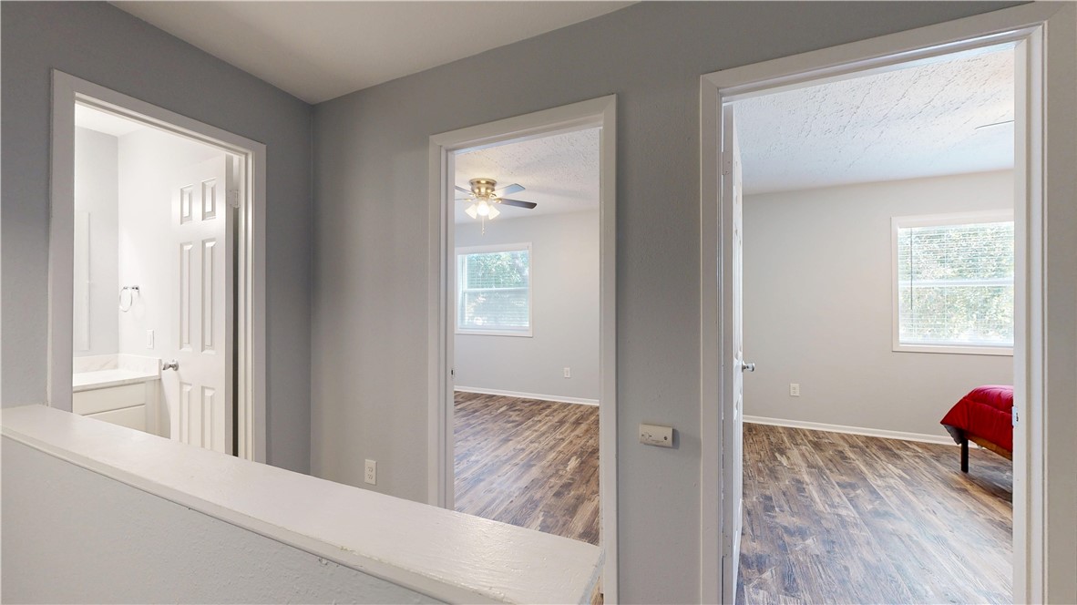 1325 Airline Drive College Station, TX 77845 - Photo 14 of 26 a view of a room that has a window and wooden floor