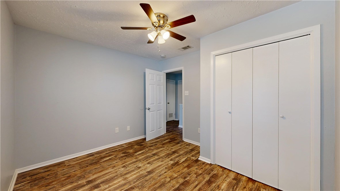 1325 Airline Drive College Station, TX 77845 - Photo 18 of 26 a bedroom with a bed and a ceiling fan