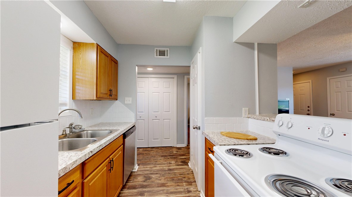1325 Airline Drive College Station, TX 77845 - Photo 6 of 26 a kitchen that has a sink and a stove