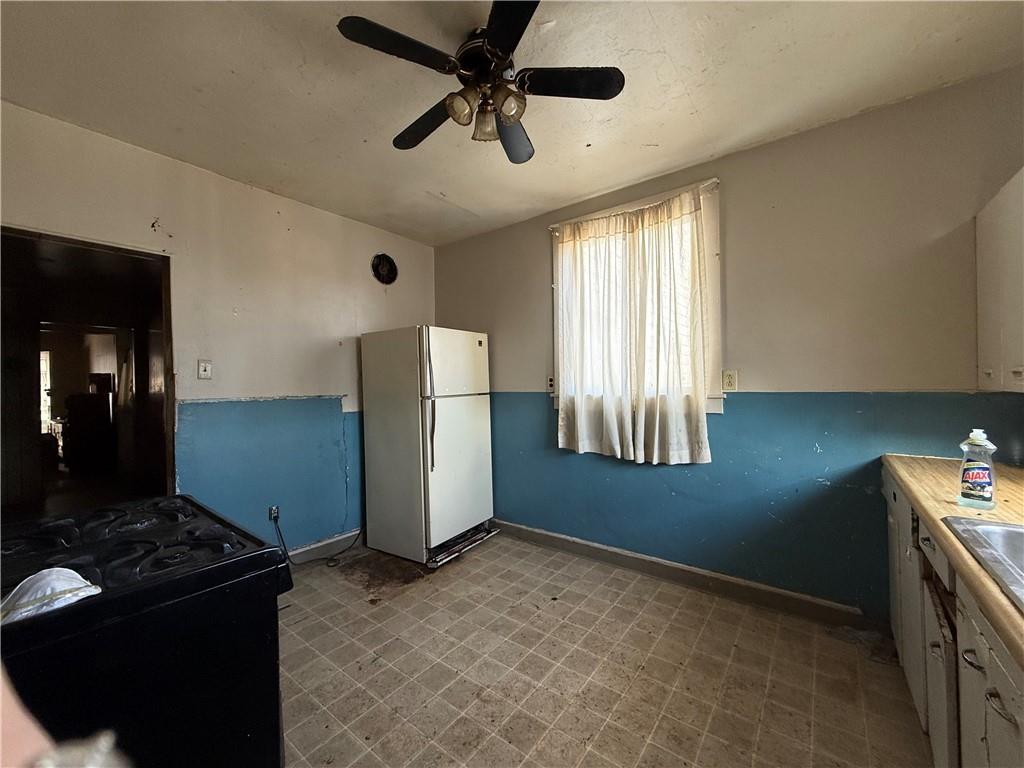 114 Thompson Avenue Donora, PA 15033 - Photo 12 of 32 a kitchen that has a cabinets and a stove
