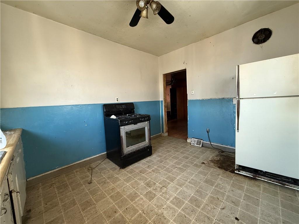 114 Thompson Avenue Donora, PA 15033 - Photo 13 of 32 a view of kitchen with stainless steel appliances cabinets and wooden floor
