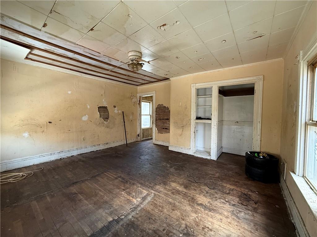 114 Thompson Avenue Donora, PA 15033 - Photo 18 of 32 a view of a hallway with wooden floor