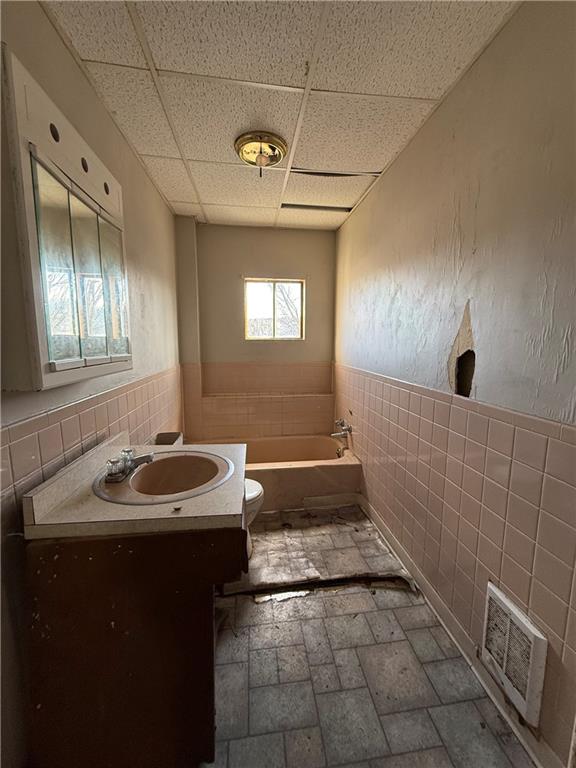 114 Thompson Avenue Donora, PA 15033 - Photo 19 of 32 a bathroom with a sink a toilet and mirror