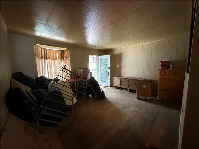 a bed room with furniture and a window