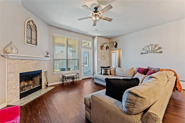 a living room with furniture and a fireplace